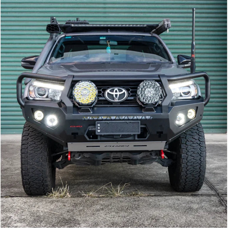 Gray Toyota Hilux with Rockarmor GT Hoop steel bull bar and aftermarket lights