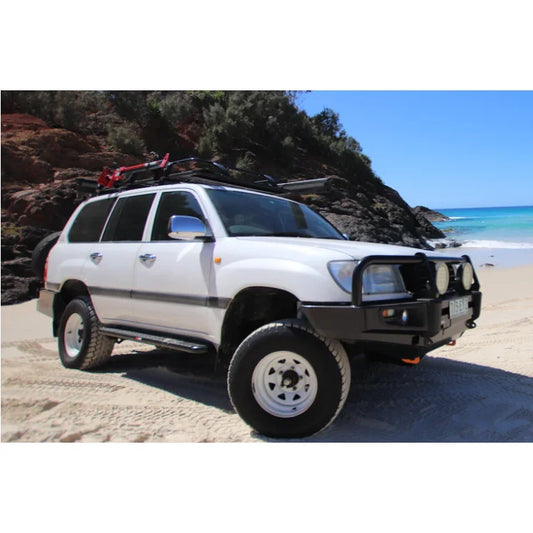 White off-road vehicle with roof rack featuring Rockarmor Steel Rockslider for Toyota Landcruiser series wagon solid