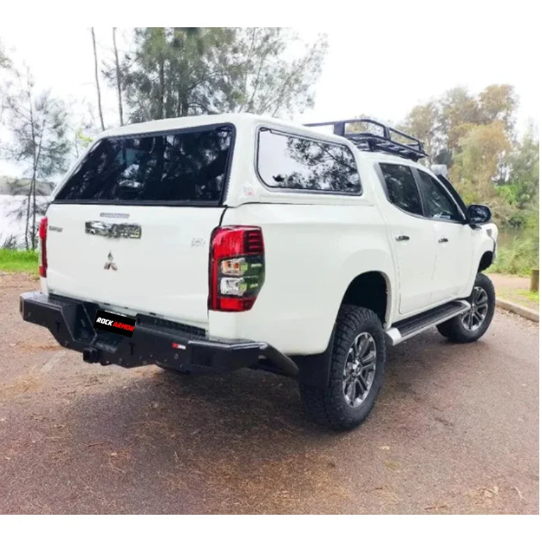 White Mitsubishi pickup truck with Rockamor Elite Steel Rear Step Towbar, rear step tow
