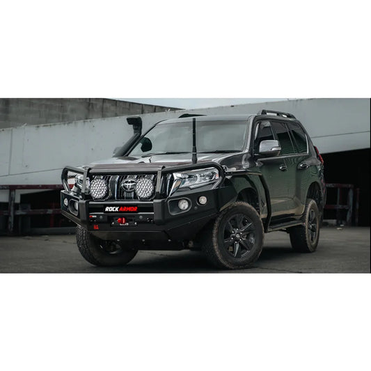 Black off-road SUV with Rockarmor Brushbar and Rockarmor Rockslider in premium steel