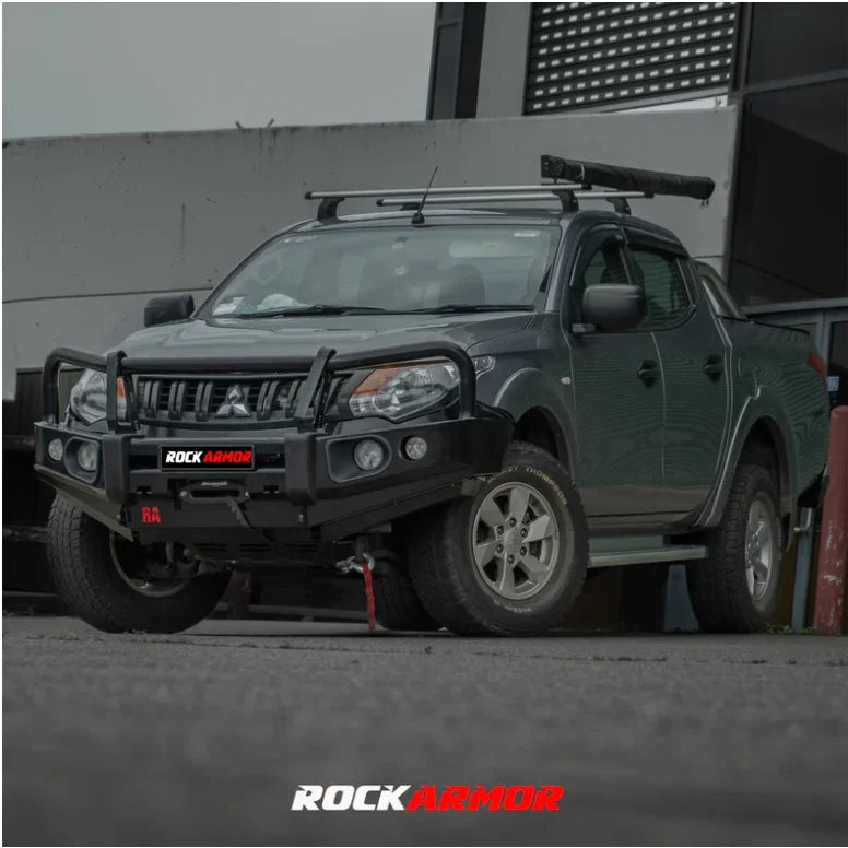 Gray pickup truck with aftermarket elite steel bullbar for Mitsubishi Triton Mq