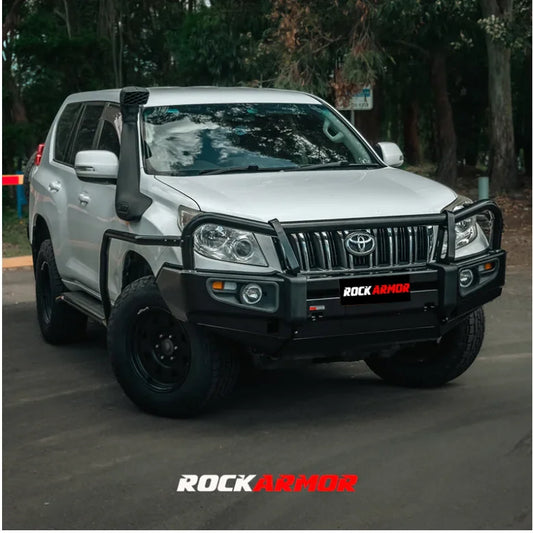 Silver off-road vehicle with black accessories featuring the Rockarmor Elite Steel Bullbar for Toyota Prado 150 2009-2013