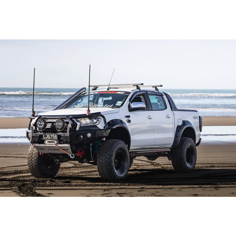 White modified pickup truck with Rockarmor GT Steel Hoop Bullbar and driving lights