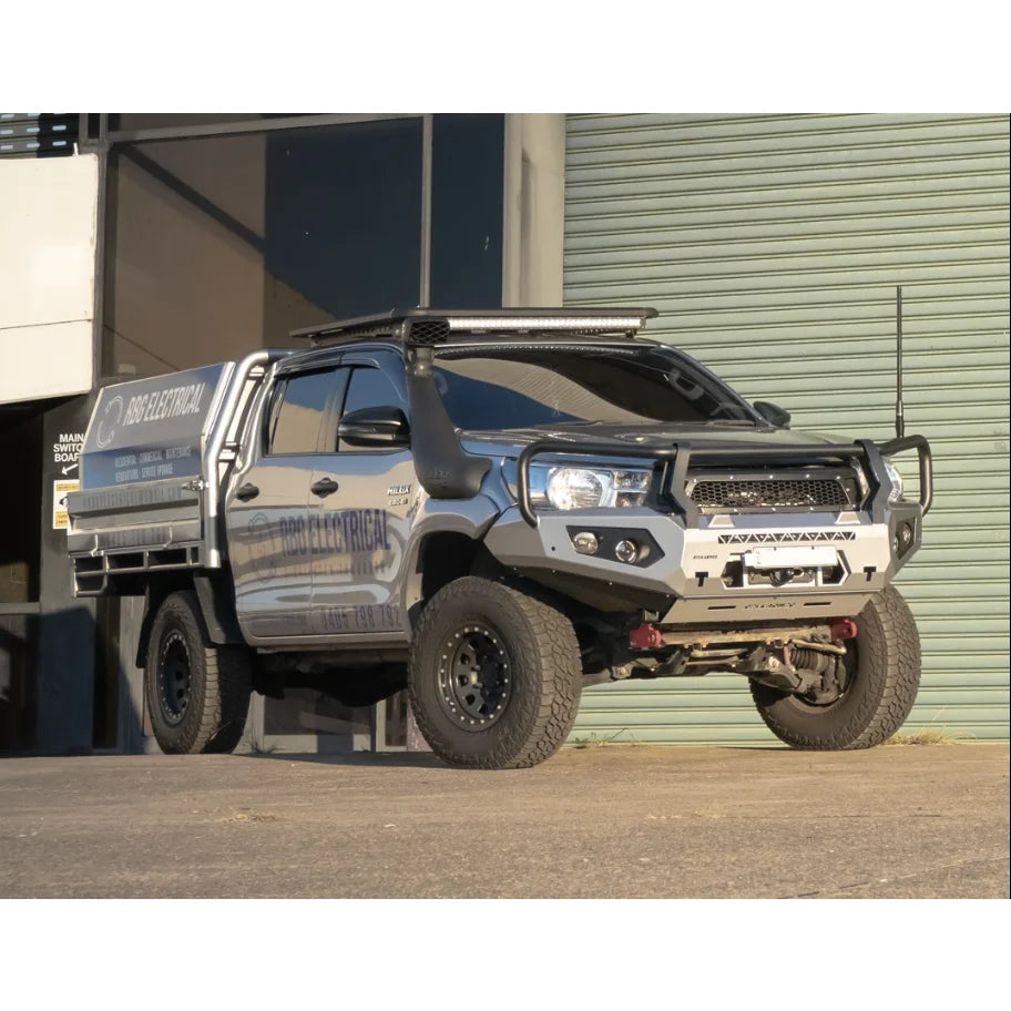 Silver off-road pickup truck with Rockarmor GT Steel Hoop Bullbar and driving lights