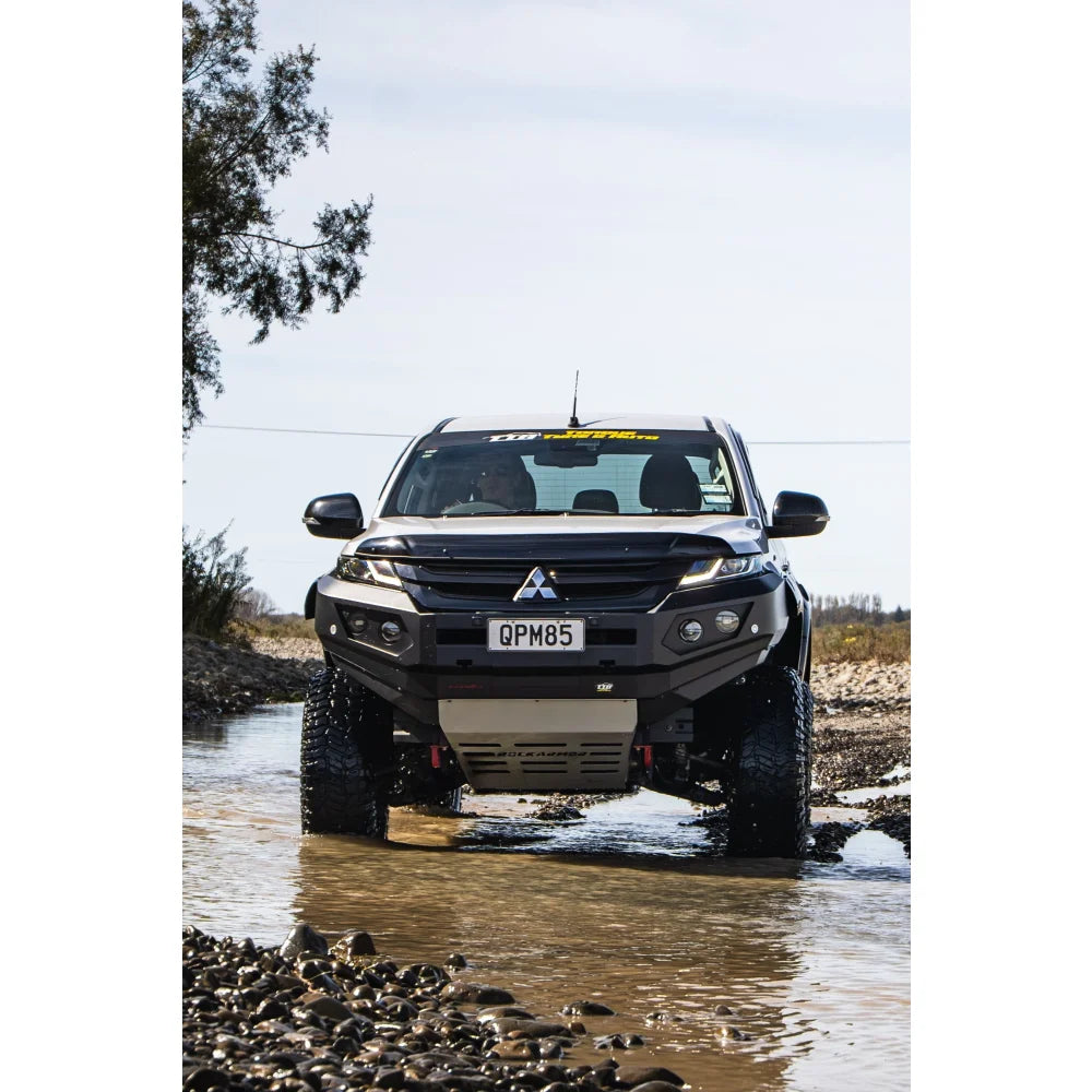Black Mitsubishi off-road truck with Rockarmor GT Steel Bull Bar and driving lights