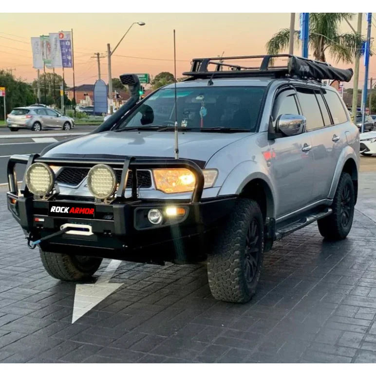 Silver SUV with off-road modifications featuring Rockarmor steel bullbar and fog lights