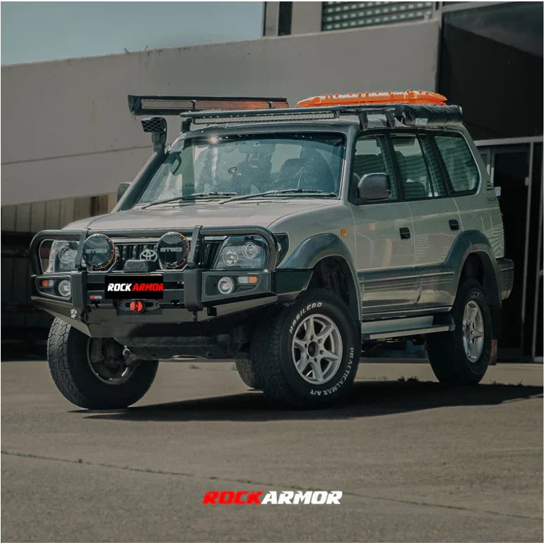 Silver off-road vehicle with Rockarmor premium steel bullbar and fog lights