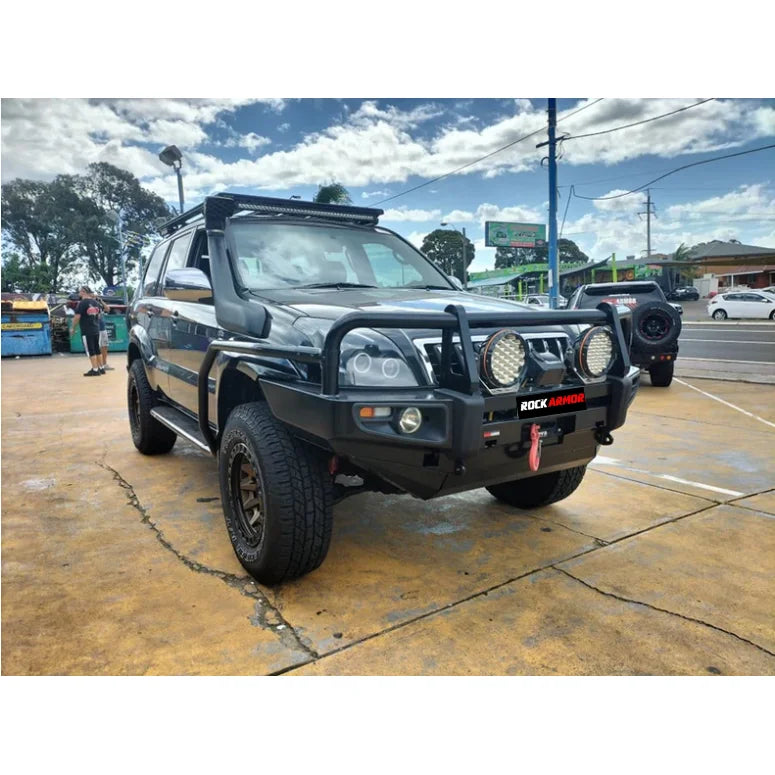Black off-road SUV with premium steel bullbar, fog lights, and roof rack for Toyota Prado Fj120