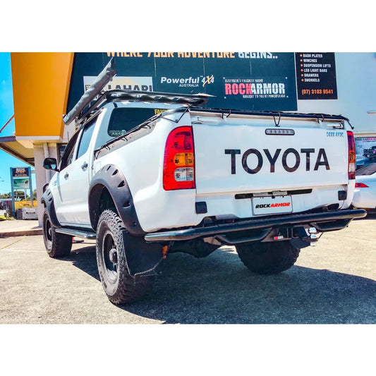 White Toyota Hilux pickup truck with Rockarmor rear step tow bar and steel rear step tow