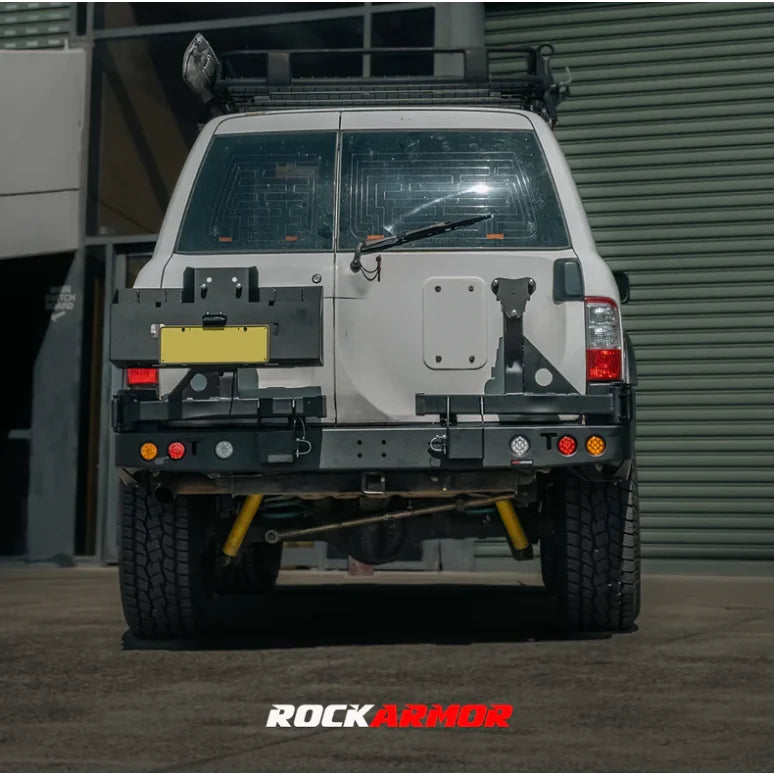 White SUV rear view with Rockarmor Steel Dual Wheel Carrier for Nissan Patrol Y61