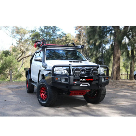 White off-road pickup truck with Rockarmor steel checker plate side steps for Toyota Hilux N70
