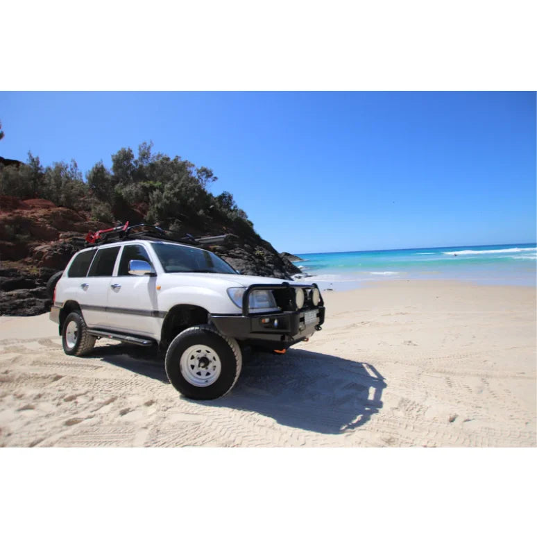 White off-road vehicle with Rockarmor Steel Rockslider suited for Toyota Landcruiser Series Wagon Solid