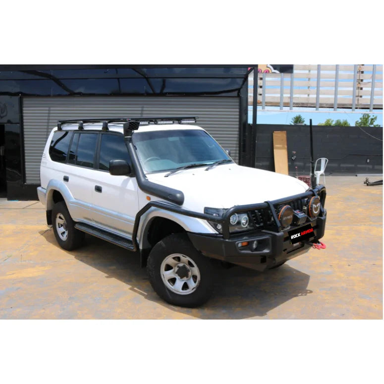 White off-road vehicle with black accessories featuring Rockarmor Steel Rockslider Side Steps, fitting video, 52mm diameter for Toyota Prado FJ90/95 Series 1995