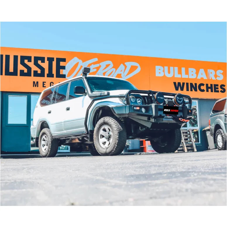 White off-road vehicle with bullbar showcasing Rockarmor Steel Rockslider Side Steps fitting Toyota Prado FJ90/95 series 1995-2003, including fitting video and