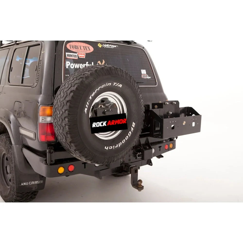 Black SUV with rear tire carrier and dual jerry cans on Rockarmor Twin Jerry Can Holder